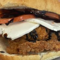 Caprese Chicken Sandwich · Organic chicken, beefsteak tomato, fresh mozzarella, red onion with a balsamic glaze on a ci...