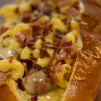The Mac Daddy · A 100% beef hot dog topped with mac n cheese and apple wood smoked bacon on a brioche bun.