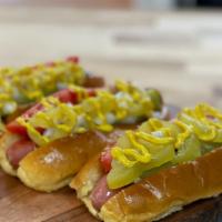 The Chicago Dog · Grilled with yellow mustard, sweet green pickle relish, onion, tomato wedges, and banana pep...