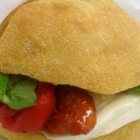 Caprese Sandwich · Fresh mozzarella, roasted peppers, sun-dried tomatoes and balsamic vinaigrette.
