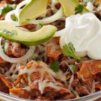 Chilaquiles · Fried tortilla depth in sauce with the meat.