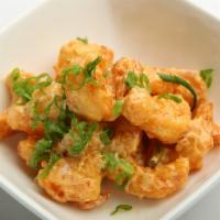 Rock Shrimp · Tempura battered shrimp that is fried and tossed in a spicy mayo, then garnished with scalli...