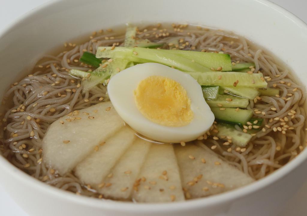 Naengmyeon · Chilled  beef broth, buckwheat noodles, cucumber, egg, pear