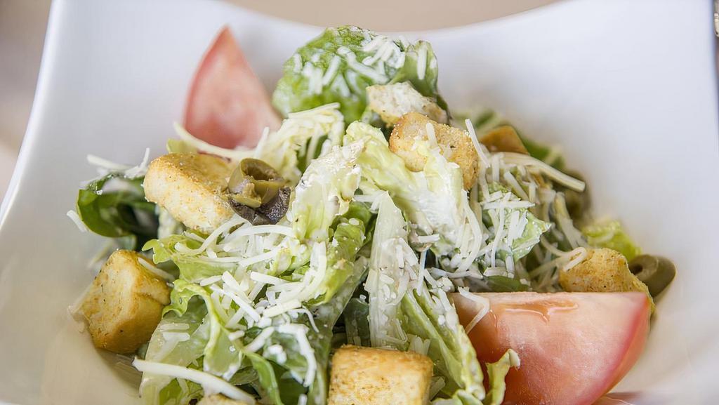 Caesar Salad · Mixed romaine lettuce with croutons and homemade caesar dressing.