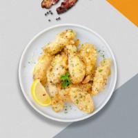Parmesan Permission Wings · Fresh chicken wings breaded, fried until golden brown, and tossed in garlic and parmesan. Se...