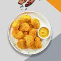Sweet But Feisty Nuggets · Bite sized nuggets of chicken breaded and fried until golden brown tossed in sweet chili sauce