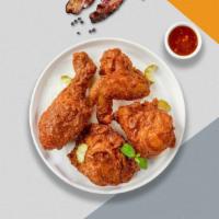The Mexican Fried Chicken · Half a bird rolled in our house seasoned batter and fried until golden tossed in chipotle bu...