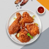 Sawadee Chili Fried Chicken · Half a bird rolled in our house seasoned batter and fried until golden tossed in thai chili ...