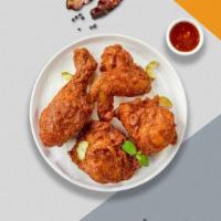 Sweet But Feisty Fried Chicken · Half a bird rolled in our house seasoned batter and fried until golden tossed in sweet chili...