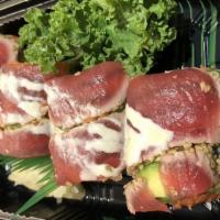 Crazy Tuna Roll · Spicy tuna, crunch, and avocado with sesame tuna on top.