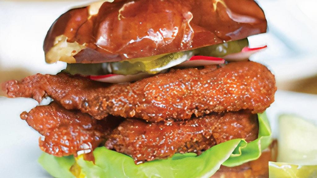 Nashville Hot Chicken Sandwich · Nashville hot chicken, 'Bama white sauce, pickles, greens, radish