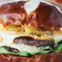 Le Big Matt · double-stack beef patties,American cheese, Sammy Sauce, greens & pickles on a pretzel bun!