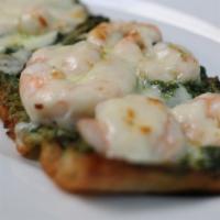 Shrimp Pesto Flatbread · Crispy flatbread topped with pesto sauce, garlic chili oil, shrimp and mozzarella cheese