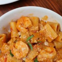 Rigatoni Shrimp Pasta · Rigatoni tossed in creamy arrabbiata sauce with shrimp, cherry tomatoes and grana