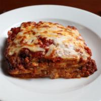 Lasagna · Layers of pasta, crushed classic meatballs and seasoned ricotta, topped with tomato sauce an...