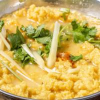 Yellow Daal · A house specialty of assorted lentils gently cooked with fresh herbs, tomatoes, and tempered...