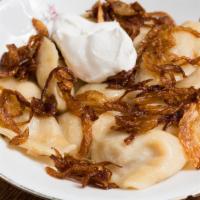 Pierogi · Homemade traditional Russian potato dumplings with fried onion and sour cream.
