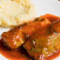 Stuffed Cabbage · Filled with ground chicken, rice, and vegetables; served with mashed potatoes.