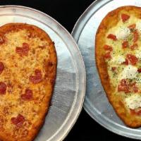 Heart Shaped Cheese Pizza · Get our dessert, heart shaped pizza for yourself or order one for your crush!  toppings addi...