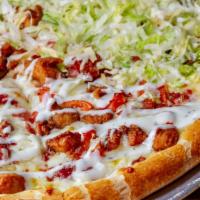 Chicken Bacon Ranch Pizza · Garlic pizza topped with seasoned fried chicken, bacon, marinated tomatoes, onion, lettuce a...