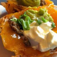 Keto Gluten Free Beef Taco · Homemade cheese taco shell served with sour cream and guacamole. Gluten-free.