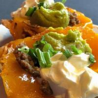 Keto Gluten Free Chicken Taco · Homemade cheese taco shell served with sour cream and guacamole. Gluten-free.