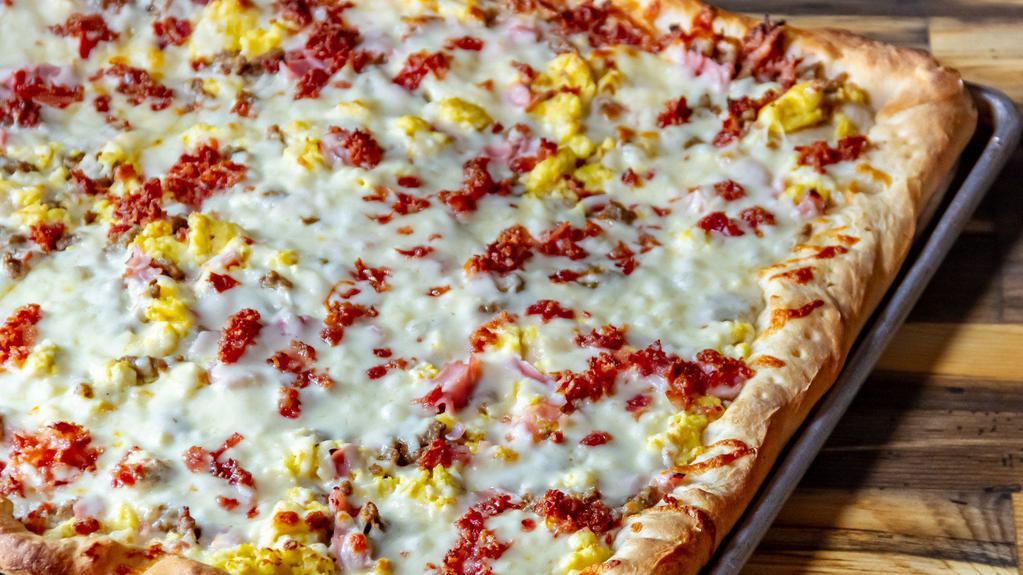 Sheet Pizza Breakfast · Bacon, sausage, ham, eggs and cheese.