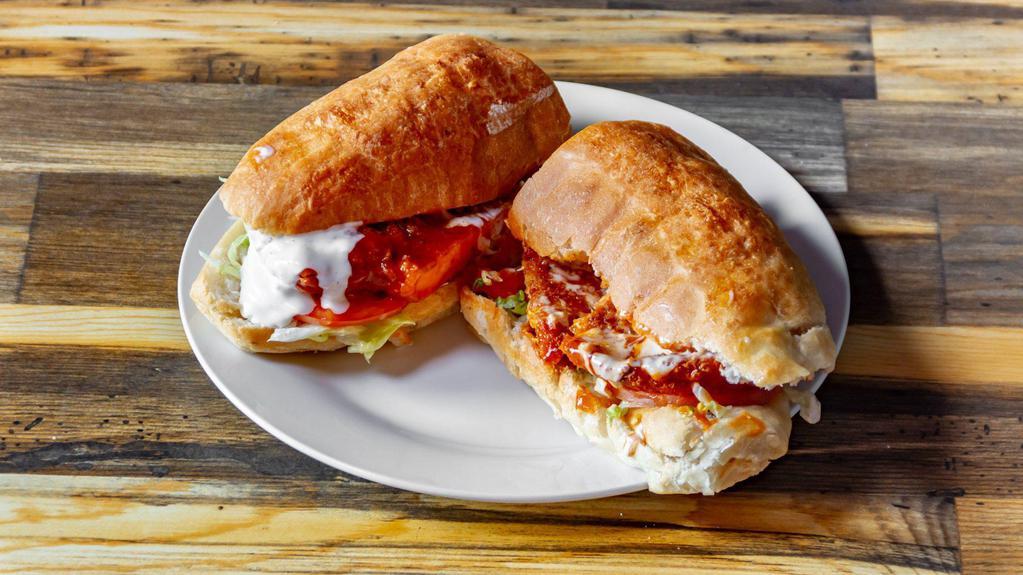 Buffalo Chicken Sub · Made with Buffalo sandwich sauce. Comes with lettuce, tomato and bleu cheese.