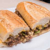Philly Cheesesteak · Seasoned beef steak grilled w/paper & onion topped w/American cheese & mayo.