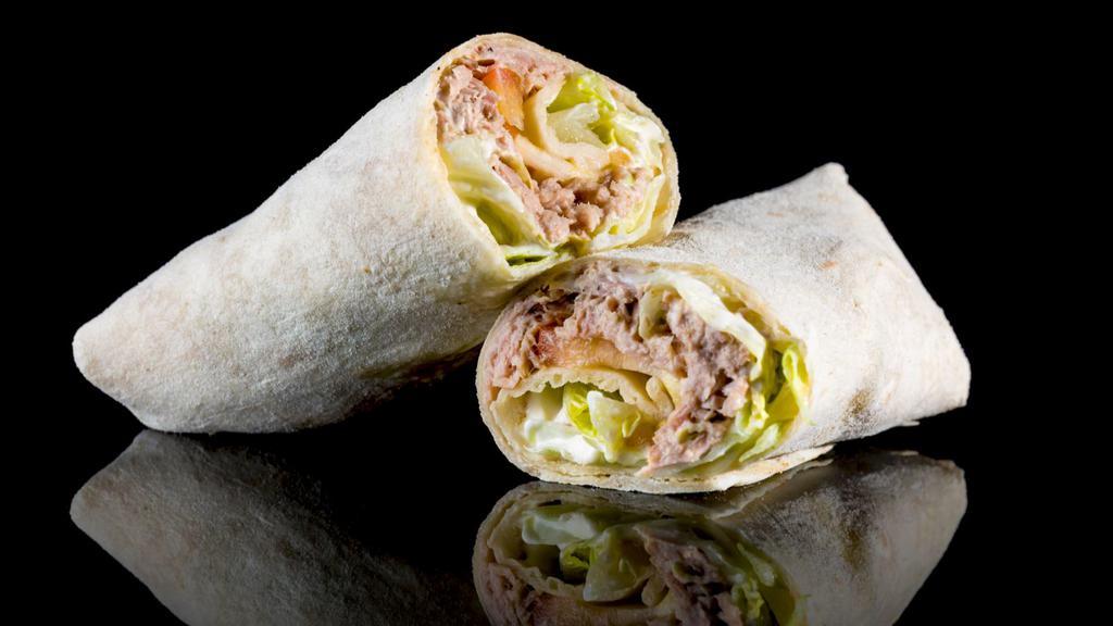 Low Fat Tuna Wrap · Fresh Wrap made with Italian style tuna salad made with sauteed vegetables and low fat Italian dressing, tomatoes and cucumbers.