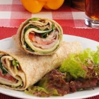 Enforcer Wrap · Fresh Wrap made with Smoked turkey, Muenster cheese, lettuce, tomatoes and Russian dressing.