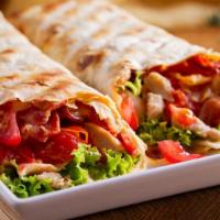 Santa Fe Chicken Wrap · Fresh Wrap made with Grilled chicken breast, bacon, Swiss, guacamole, lettuce, tomato and sa...