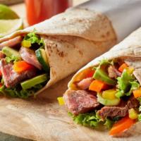 Mexican Steak Wrap · Grilled skirt steak and avocado, minced chipotle peppers, cilantro, grilled multi-colored be...