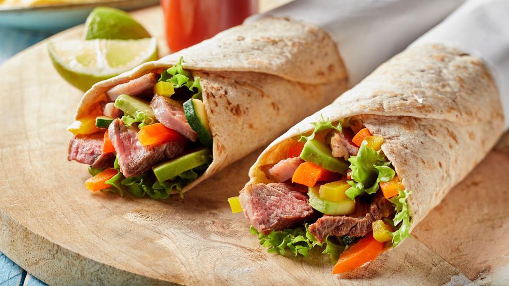 Mexican Steak Wrap · Grilled skirt steak and avocado, minced chipotle peppers, cilantro, grilled multi-colored bell peppers, onions and unique blend of spices.