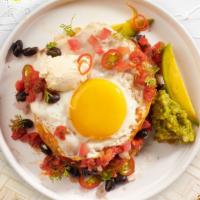 Raunchy Huevos Rancheros  · Lightly fried eggs served on a warm tortilla and topped with salsa, tomatoes, chili peppers,...