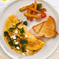 Gods Of Eggs · Eggs cooked with cheese, spinach and olives as an omelette or scrambled eggs served with toa...