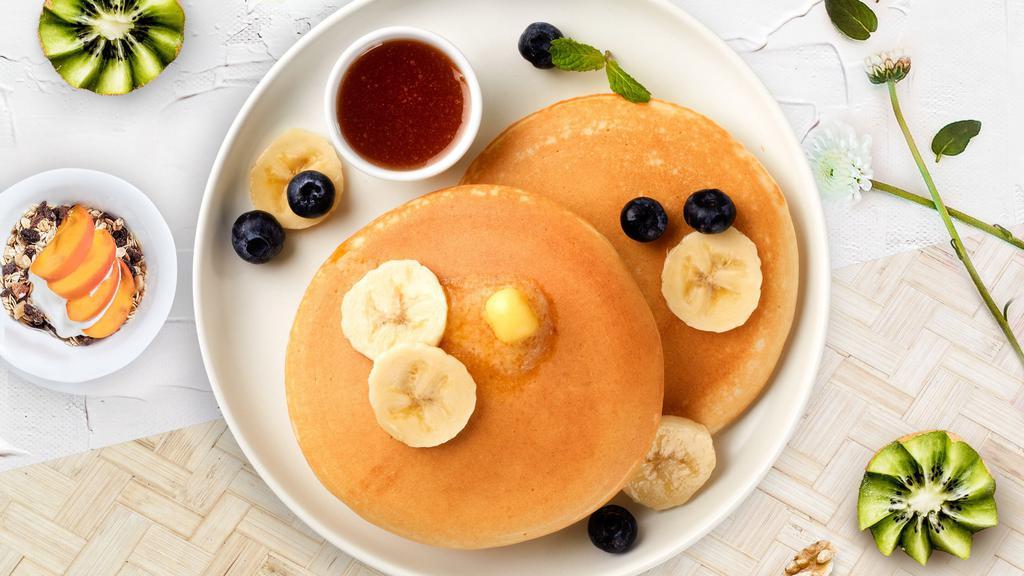 Going Bananas Berry Pancakes · Fluffy banana and berries pancakes cooked with care and love served with butter and maple syrup. Three pancakes.
