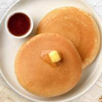 Classic Pancakes · Fluffy pancakes cooked with care and love served with butter and maple syrup. Three pancakes.