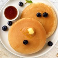 Very Blueberry Pancakes · Fluffy pancakes cooked with care and love served with blueberries, butter and maple syrup. T...