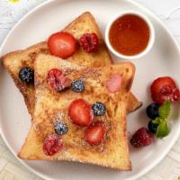 Very Berry French Toast · Fresh bread battered in egg, milk, and cinnamon cooked until spongy and golden brown. Topped...