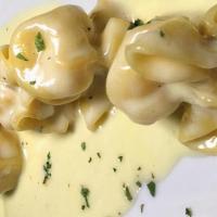 Troffolini · Stuffed pasta with ricotta and pear and truffle cream sauce.