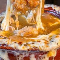 French Onion Soup · Provolone, swiss, parmesan, and crouton.