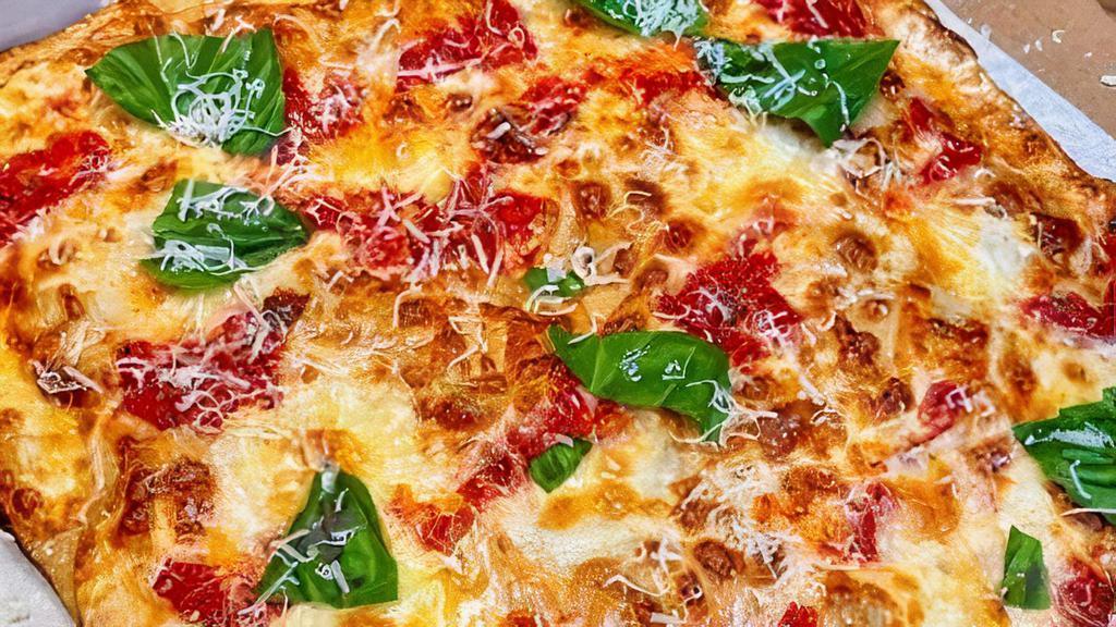 Grandma Pizza · 6 slices. Thin Crust Pan Pizza Garlic plum Tomato sauce, Mozzarella- Basil.