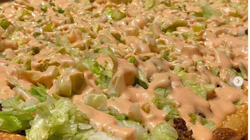 Big Mac Pizza · 8 slices. Beef, lettuce, tomatoes, pickles, mac sauce, American cheese.