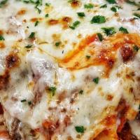 Lasagna Bolognese · Layered pasta, meat, bechamel, and mozzarella.