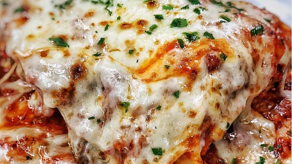 Lasagna Bolognese · Layered pasta, meat, bechamel, and mozzarella.