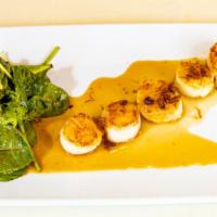 Scallop · Cooked and seasoned mollusk.