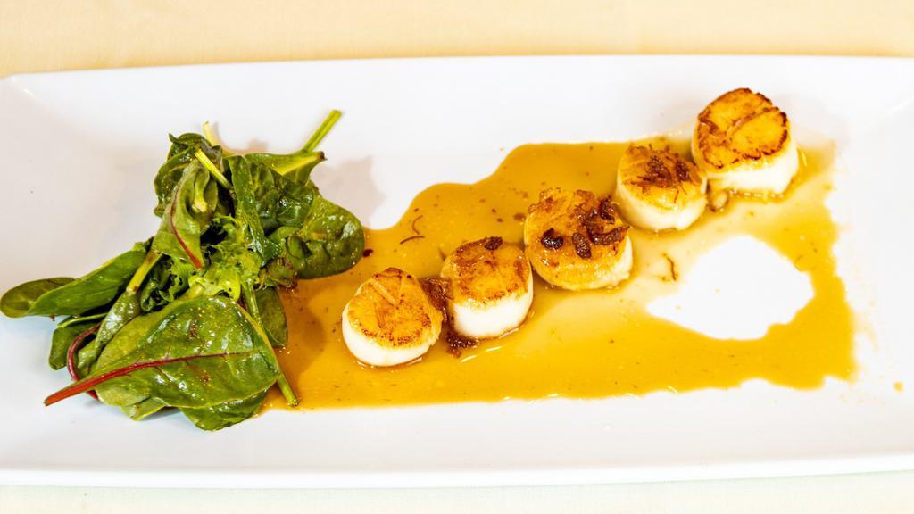 Scallop · Cooked and seasoned mollusk.