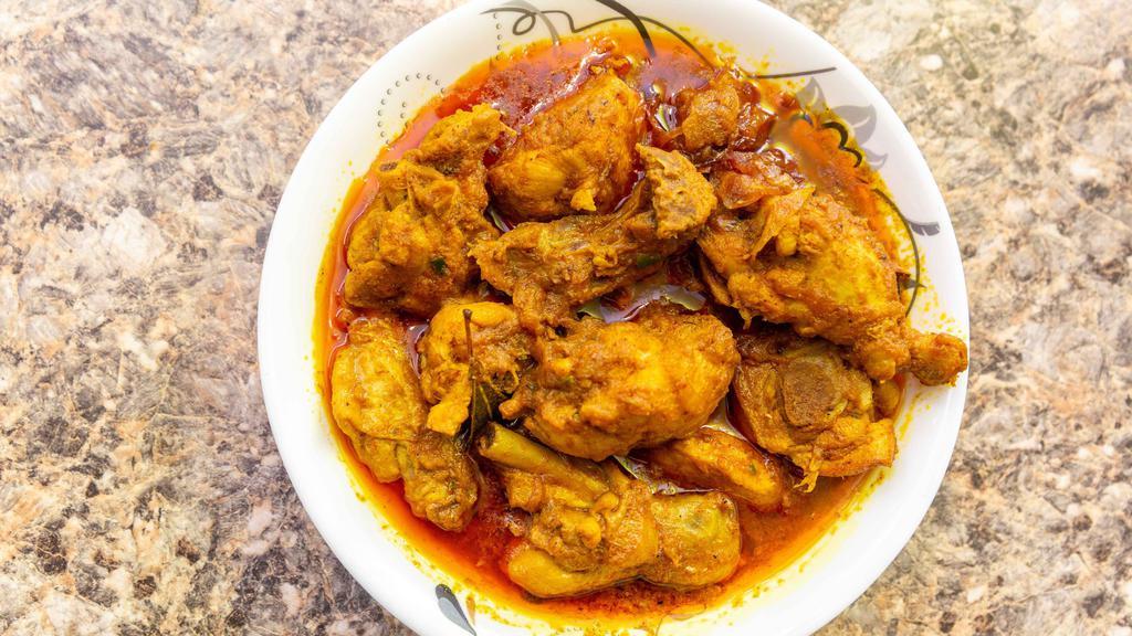 Curry Chicken · Chicken cooked with spices, gravy.