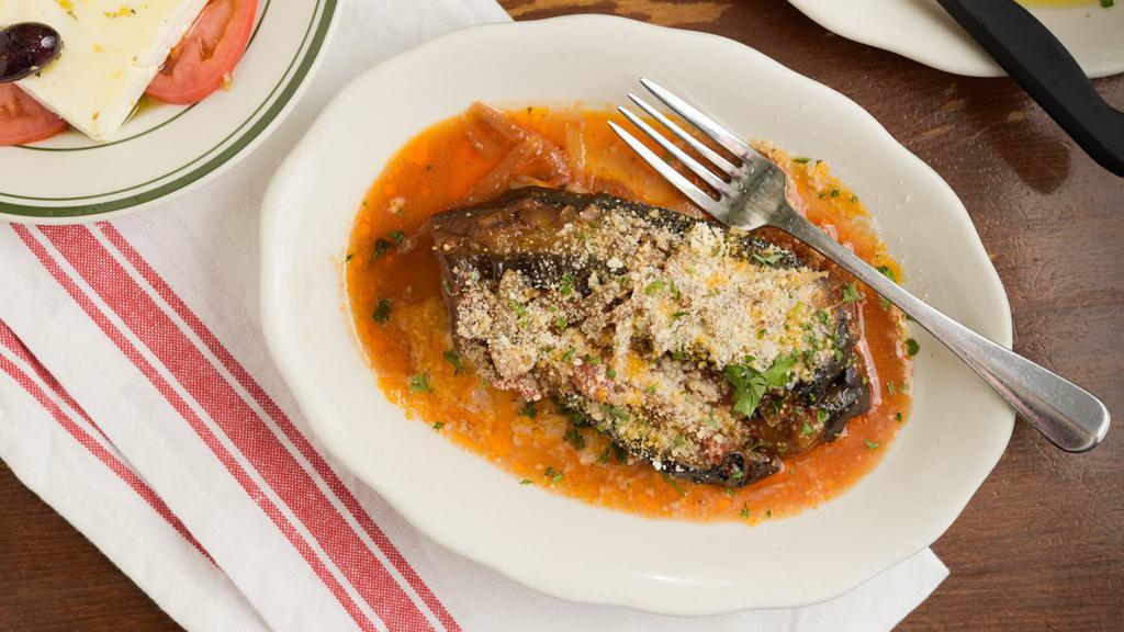 Imam · Baby eggplant stuffed with tomato, garlic, onions, and cheese.